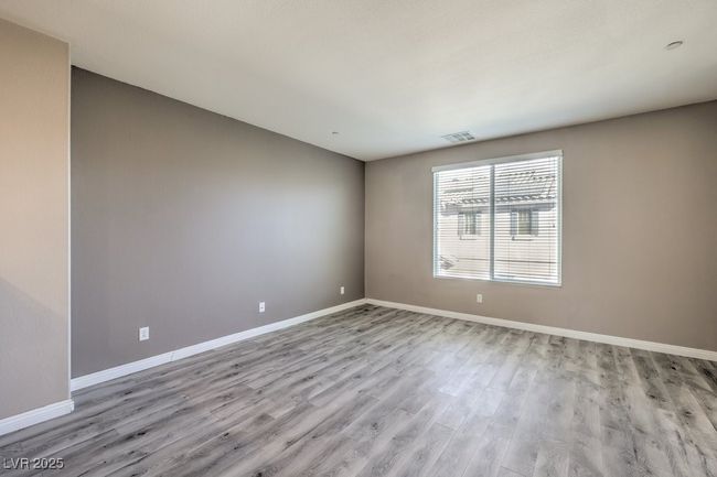 Unfurnished room featuring baseboards, visible vents, and wood finished floors | Image 32