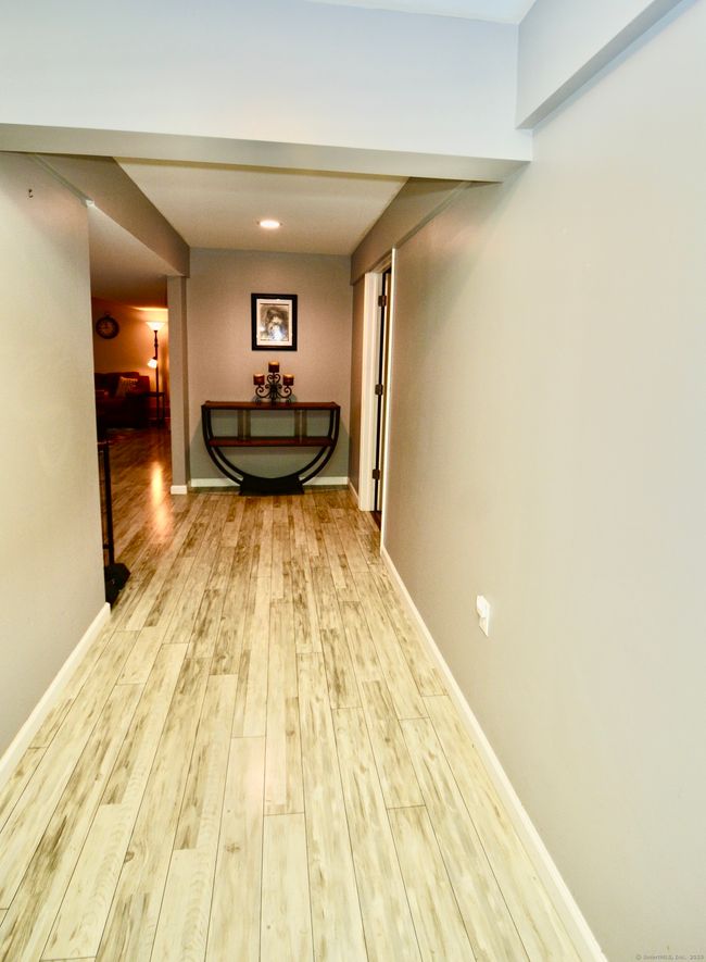 bottom of stairway leading to finished off basement | Image 28