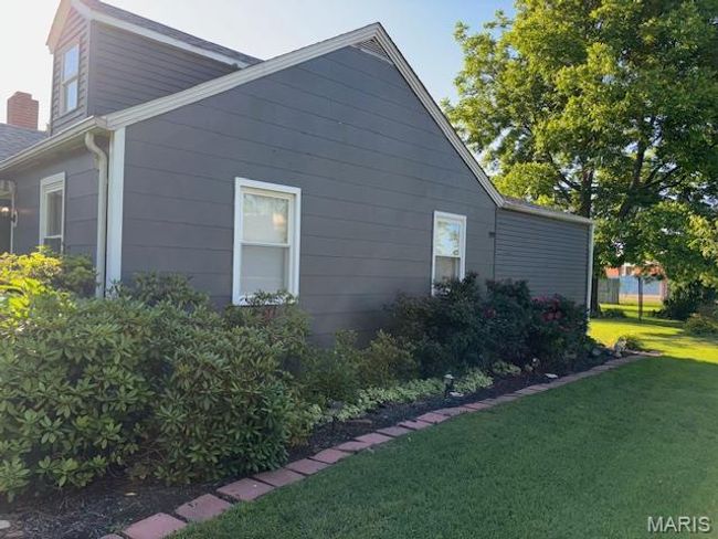 View of side of home featuring a lawn | Image 5