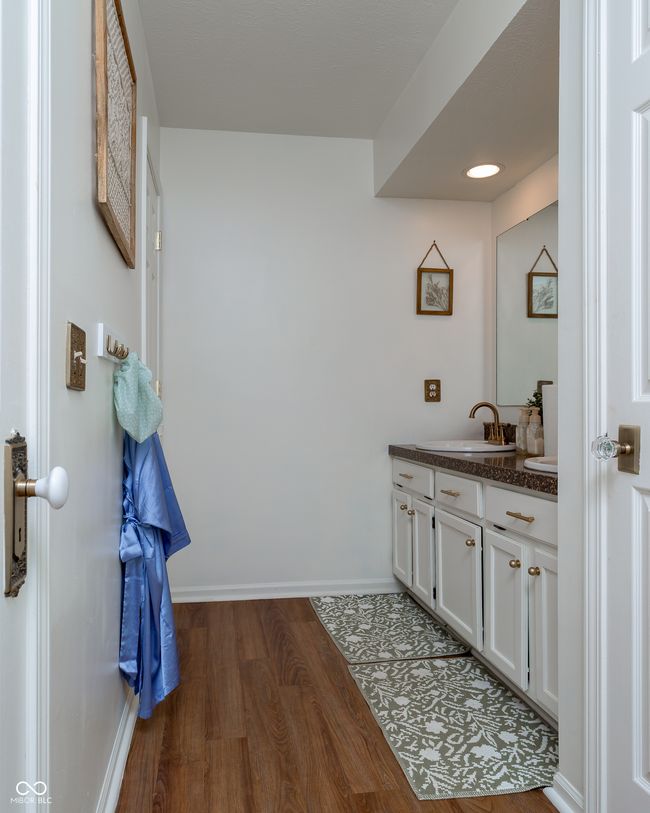 bathroom featuring vanity and wood finished floors | Image 22