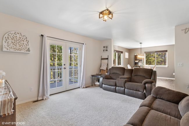 Living area with french doors, carpet, and baseboards | Image 14