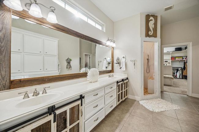 Primary bath and entry into master closet. | Image 16