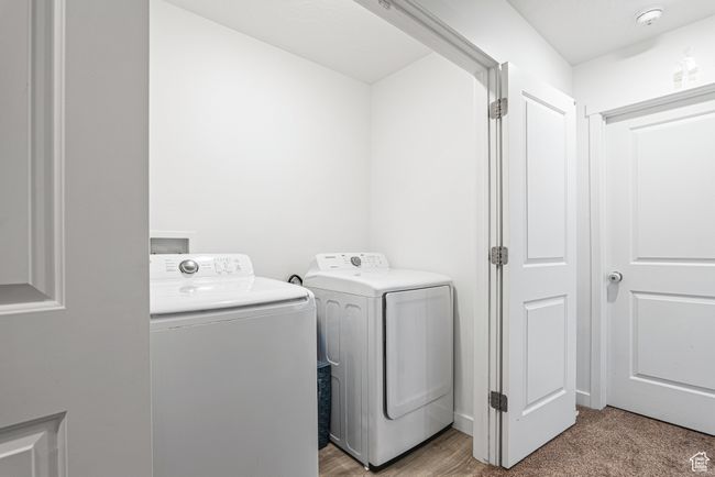 Laundry area with washer and clothes dryer | Image 19
