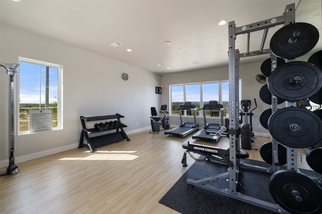Workout area with wood finished floors, baseboards, and recessed lighting | Image 27