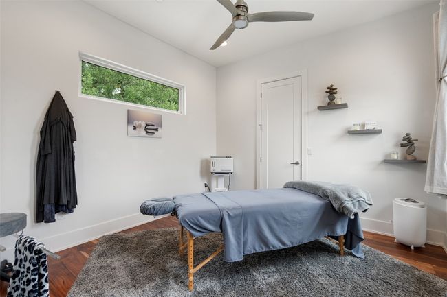 A peaceful upstairs bedroom with soft light and spacious design. | Image 28