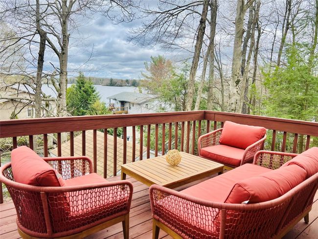Wooden deck featuring an outdoor living space | Image 12