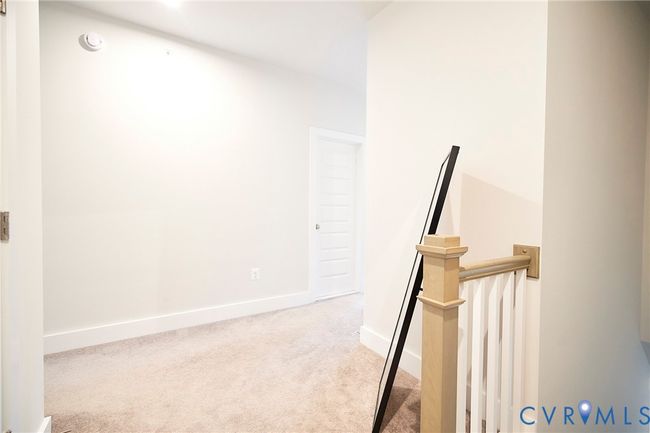 Hallway with an upstairs landing and carpet | Image 17