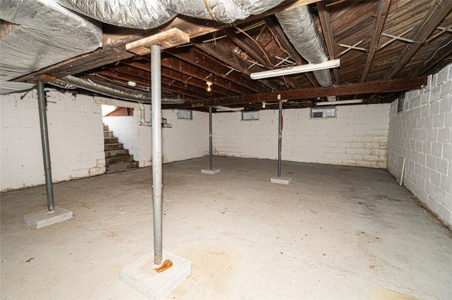 Unfinished below grade area featuring stairs | Image 11