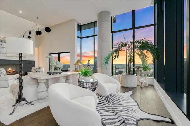 Natural light floods the space by day, while city lights offer a dazzling display at night. | Image 7