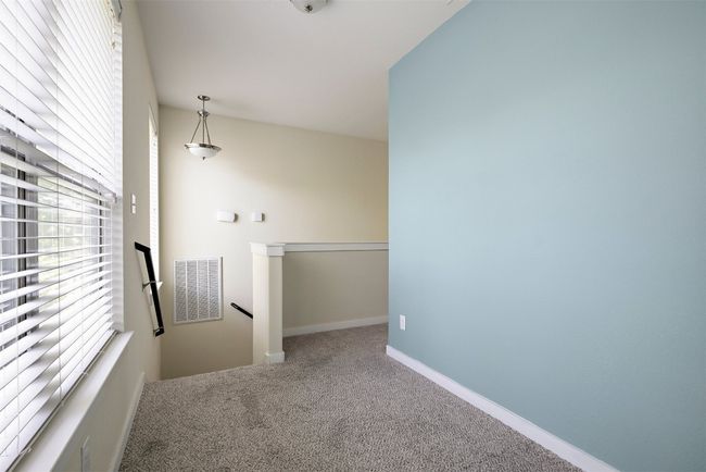 With its open, airy feel and ample natural light, the loft is a welcoming area that enhances the home's overall flow while providing a comfortable retreat from the main living areas | Image 25