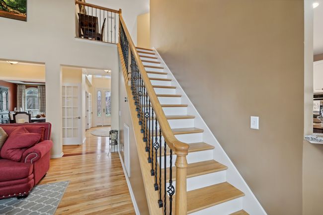 Heading up to the second level, you'll find 3 large additional bedrooms and bonus room with storage. | Image 26
