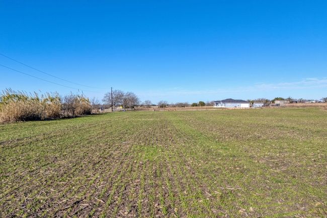 View of green lawn featuring a rural view | Image 6