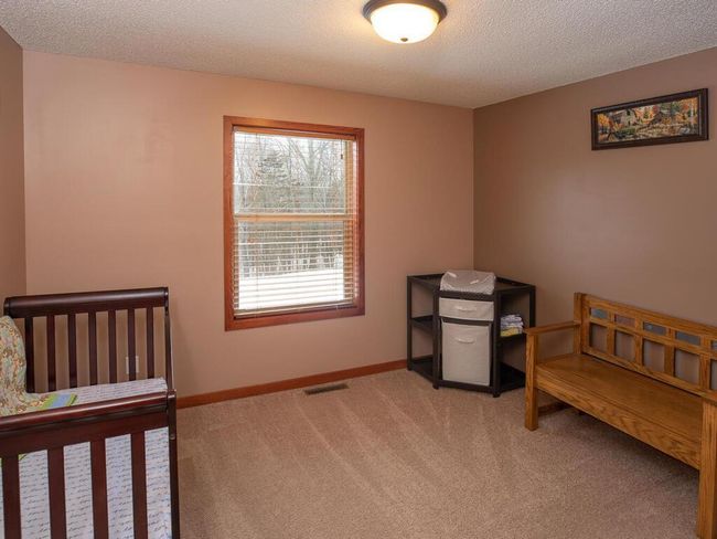 Bedroom 2 has view of wooded back yard | Image 25