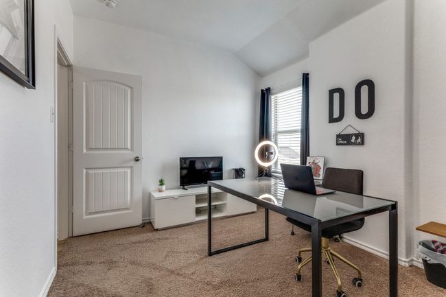 Carpeted home office with vaulted ceiling and baseboards | Image 18
