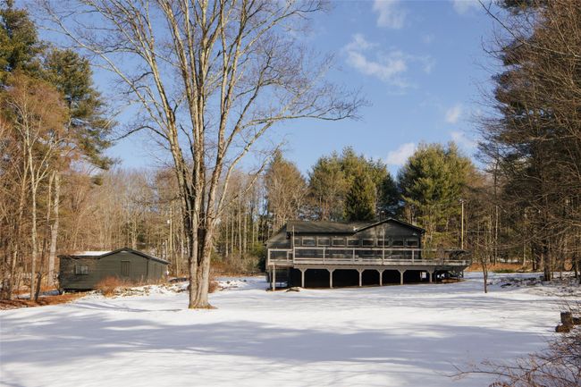 View of front of house featuring a deck and a sunroom | Image 26