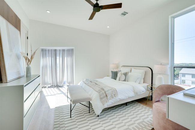 Bedroom featuring light hardwood / wood-style floors and ceiling fan | Image 17