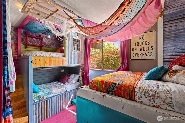 Second bedroom features handcrafted built-in bunk beds, combining cozy comfort with stylish charm. | Image 19