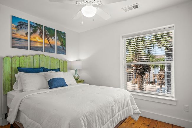 Guest bedroom with pool views out the window | Image 18