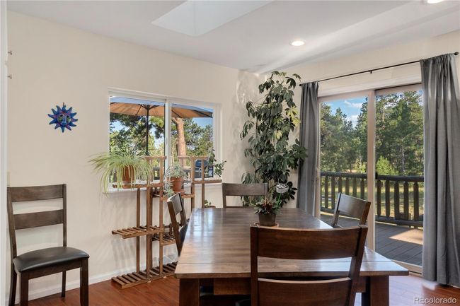 Main floor dining and deck access | Image 9