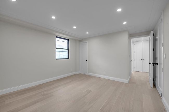 Unfurnished room featuring light wood-style flooring and recessed lighting | Image 9