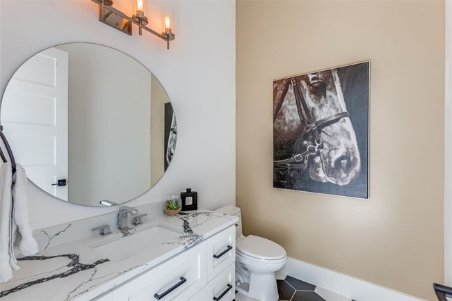 Bathroom with tile patterned floors, vanity, and toilet | Image 25