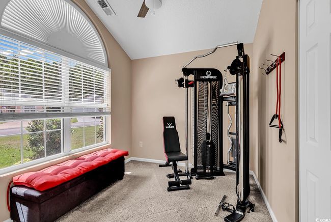 lofted ceiling, carpet floors, and a ceiling fan | Image 5