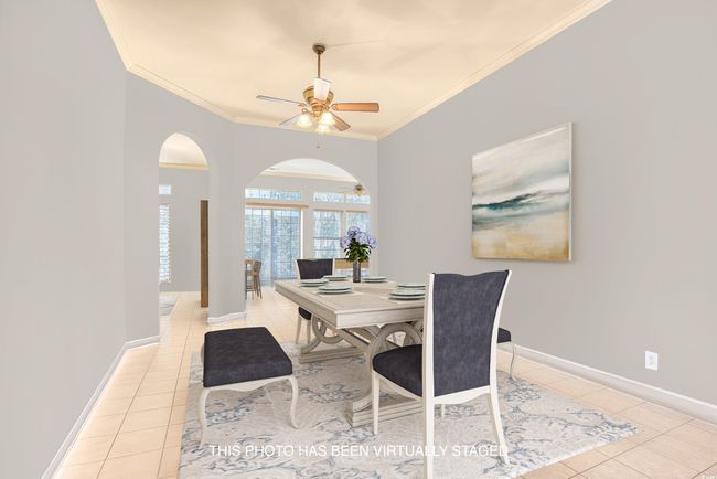 VIRTUALLY STAGED AS THE DINING ROOM AND PAINTED VIRTUALLY TO SHOW A LIGHTER COLOR | Image 6
