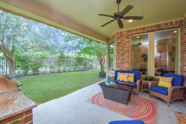 Enjoy unobstructed views with a wrought iron fence. | Image 38