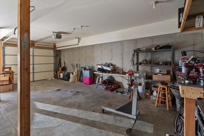 Garage with a garage door opener | Image 38