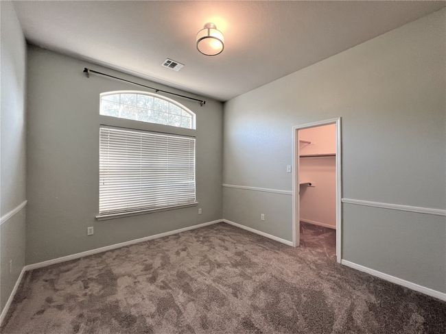 Carpeted spare room with baseboards | Image 12