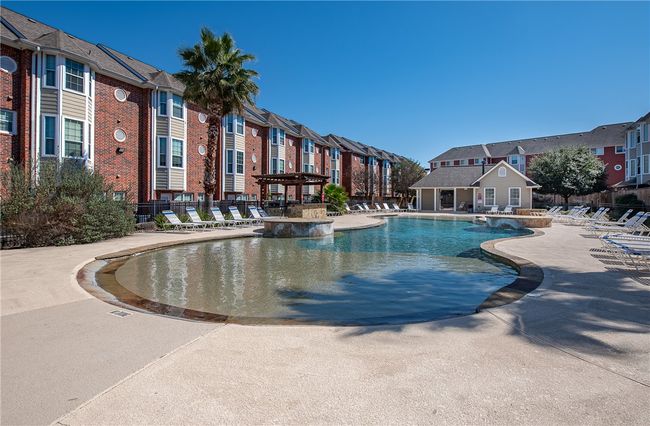 Resort style pool with a beach entry | Image 26