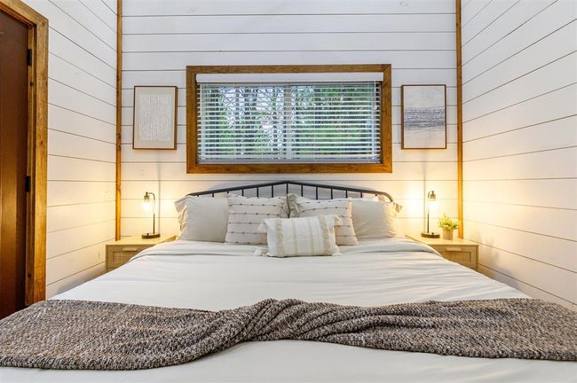 Bedroom featuring wood walls | Image 27