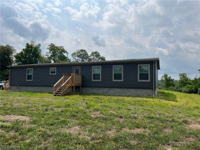 Back of house with a lawn | Image 3