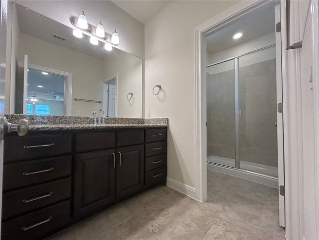 upstairs hall bathroom with separate shower and toielt room | Image 18