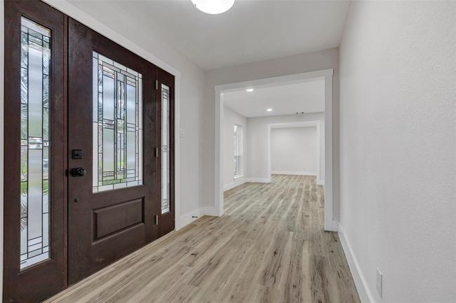 Grand entrance with brand new wide glass door and Vinyl flooring and fresh paint! | Image 5