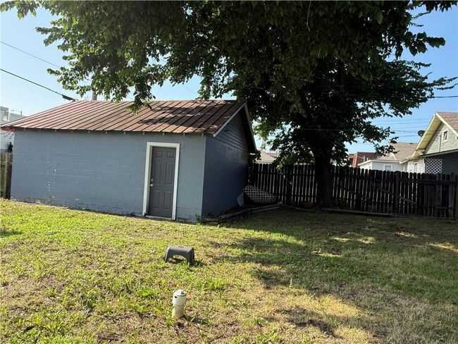 View of yard with an outbuilding | Image 31