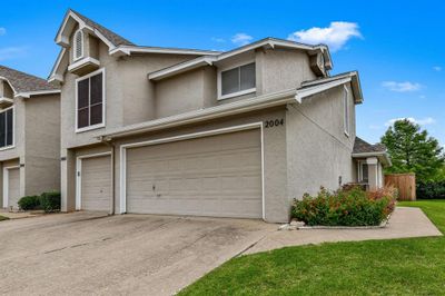 View of front of property with a garage | Image 1