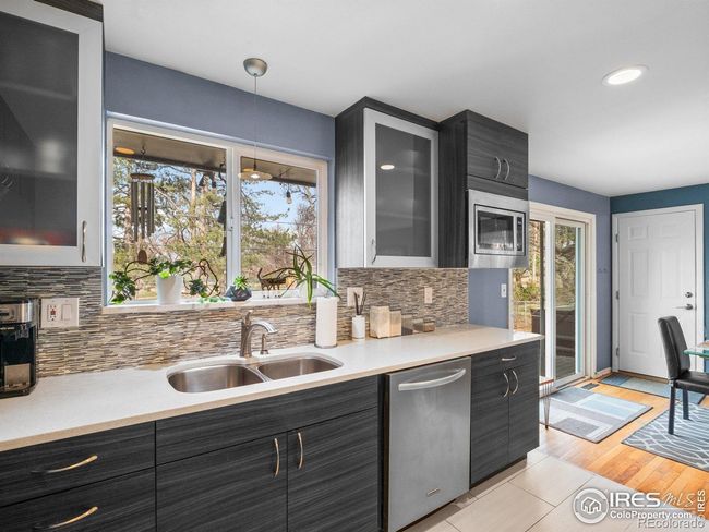 Updated cabinetry and tile backsplash | Image 7