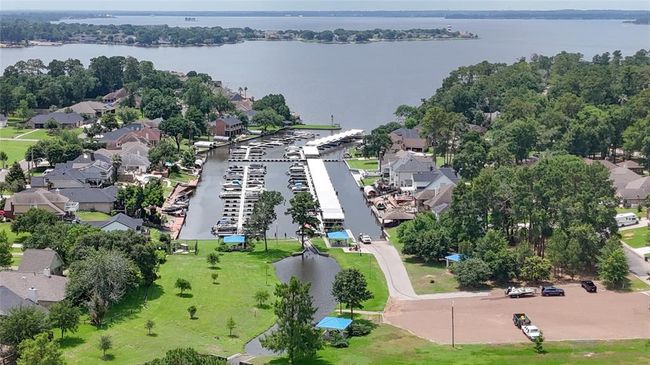 The gated community of Point Aquarius offers direct access to Lake Conroe with a private boat ramp and a marina for convenient boat storage, making it easy to enjoy lakeside living and water activities year-round. | Image 48