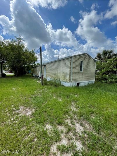 View of side of property with a yard | Image 2