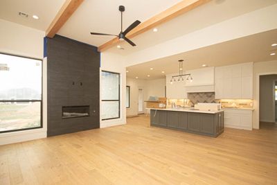 The large open floorplan of this exquisite home creates an inviting space, flooded with natural light, perfect for gatherings and relaxation. | Image 2