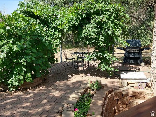 View of patio with grilling area and outdoor dining space | Image 14