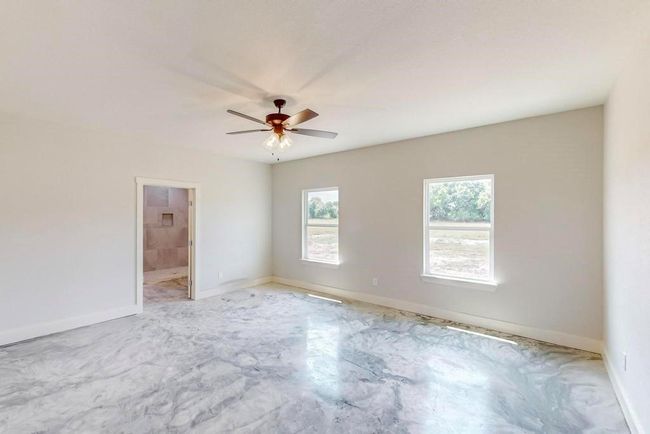 Empty room with baseboards and a ceiling fan | Image 15