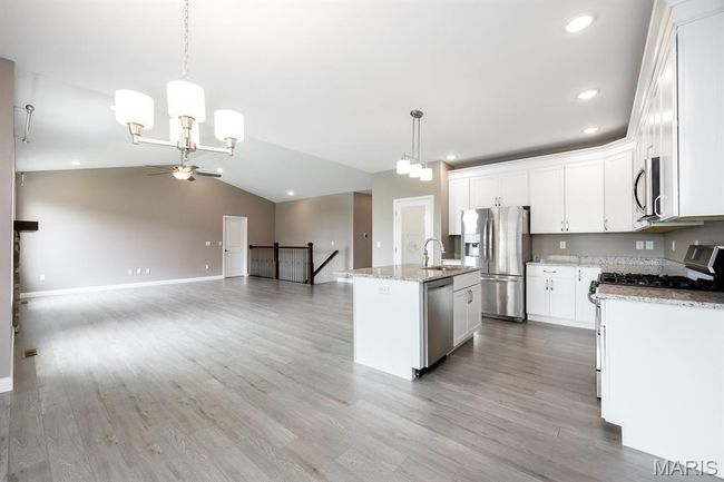 LVP flooring, open to kitchen | Image 8