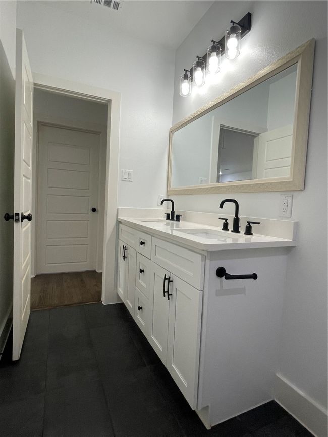 Bathroom featuring double vanity | Image 30