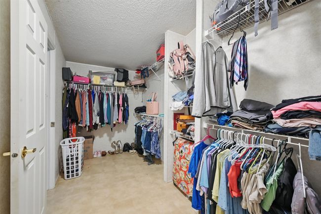 View of spacious closet | Image 12