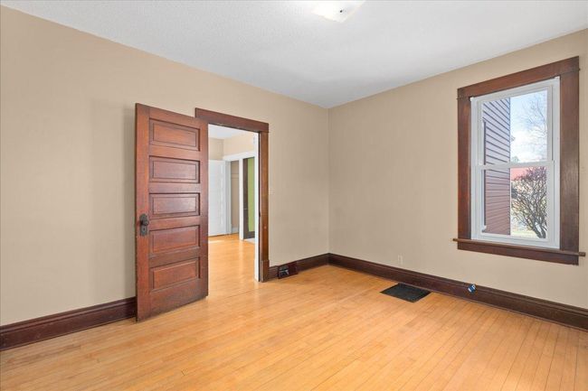 Another view of the main floor bedroom | Image 10