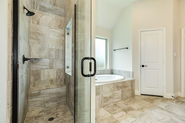 view of the glass shower and soaking tub | Image 34