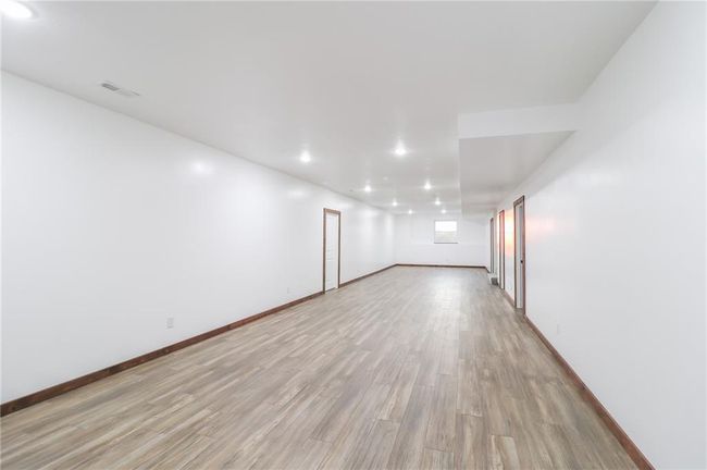 Empty room with light hardwood / wood-style flooring | Image 38