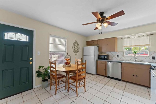 Roomy kitchen with plenty of space for a second dining table or breakfast nook—perfect for casual meals, homework time, or extra guests. | Image 12